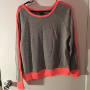 Gray crew neck sweatshirt with neon orange accents