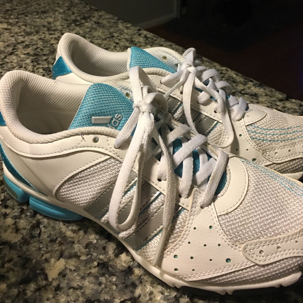 Adidas white athletic shoe trimmed in blue