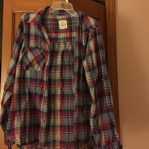 Flannel button shirt.