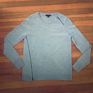 A light blue J. Crew pullover sweatshirt.