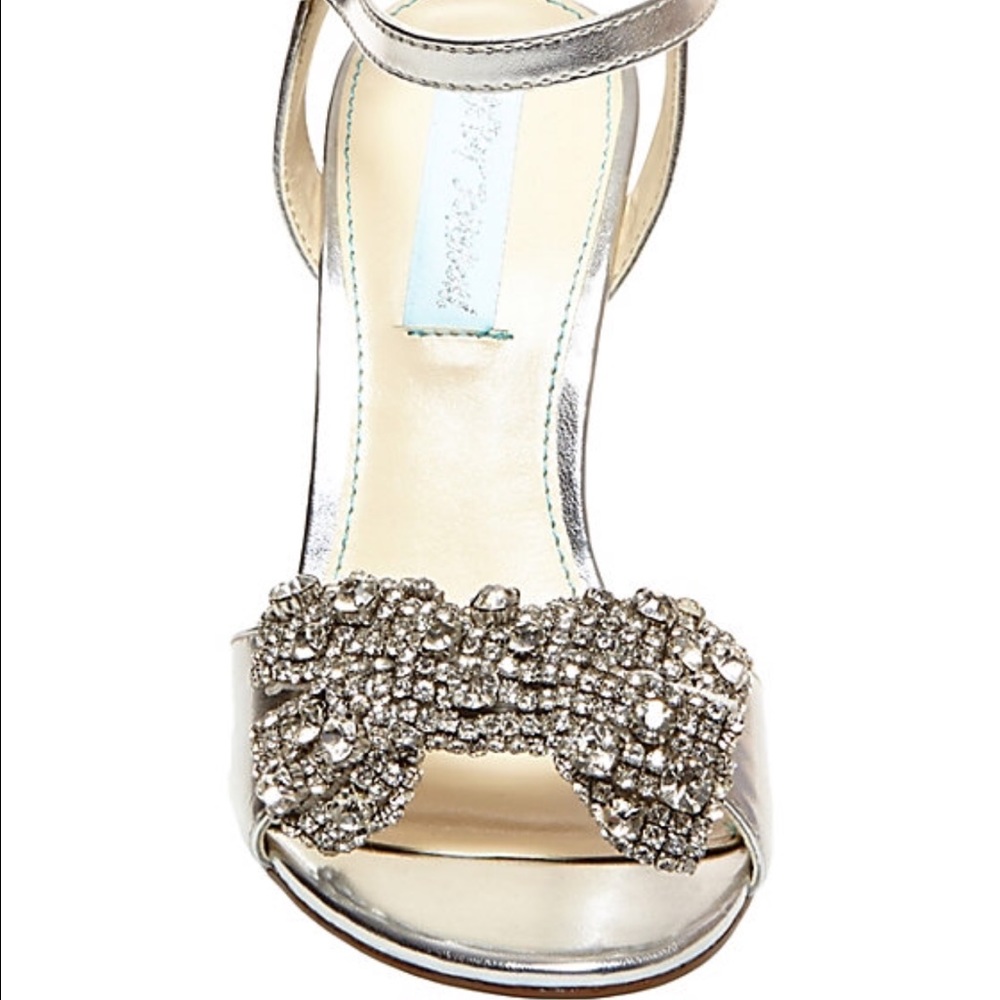 silver wedges with bedazzled bows.