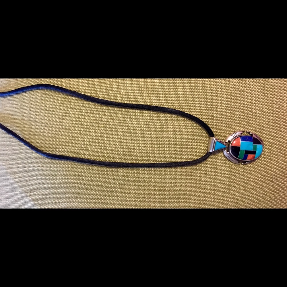 Sterling silver Turquoise pendant on silk rope.