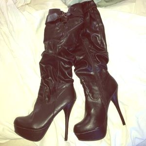 Over the knee black leather boots