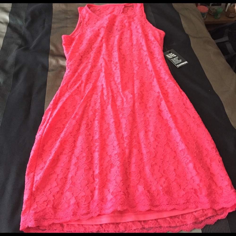 A pink lace open back cocktail dress
