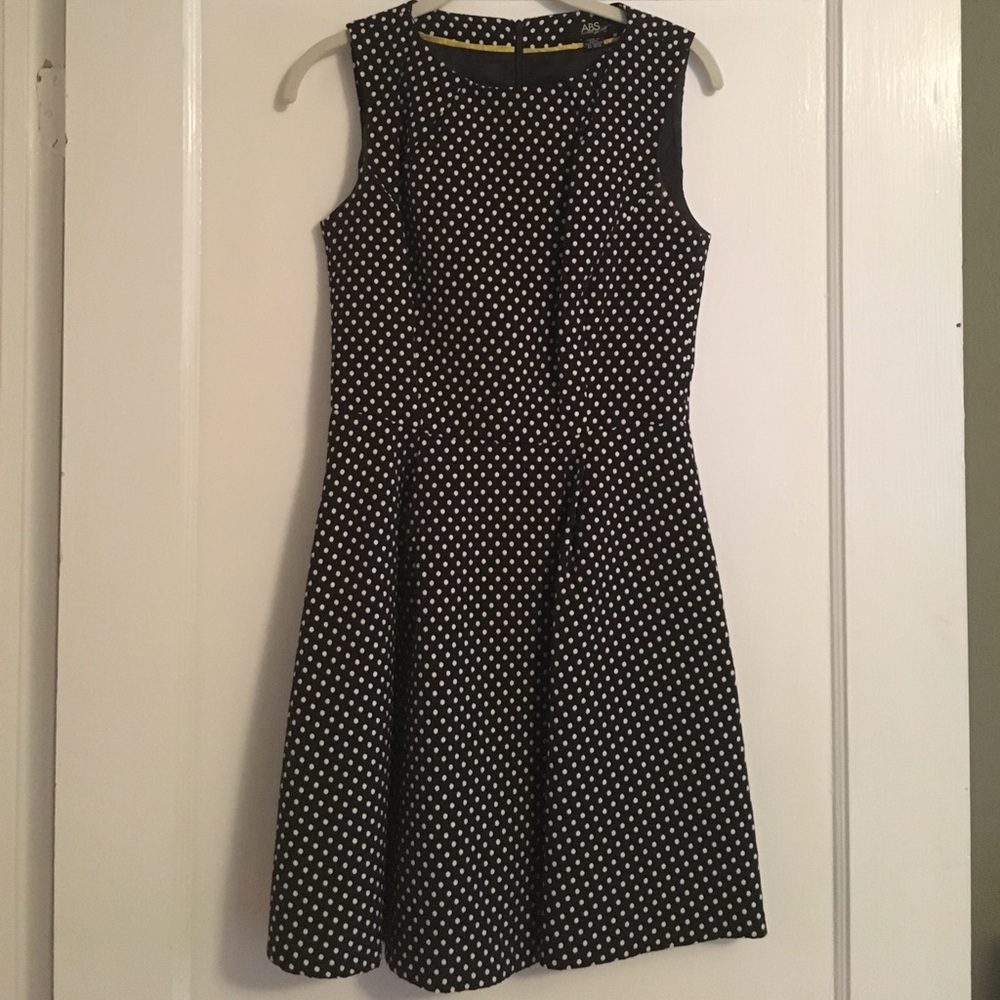 Dotted navy and white fit and flare dress.