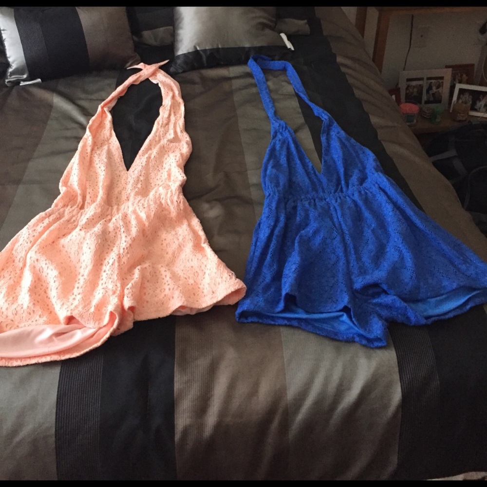 Two beautiful light pink and blue romper set .