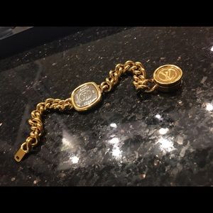 Louis Vuitton bracelet gold stainless steel.