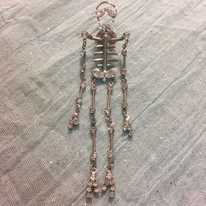 Intricate skeleton pin.