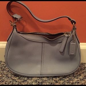 Light blue small coach bag.