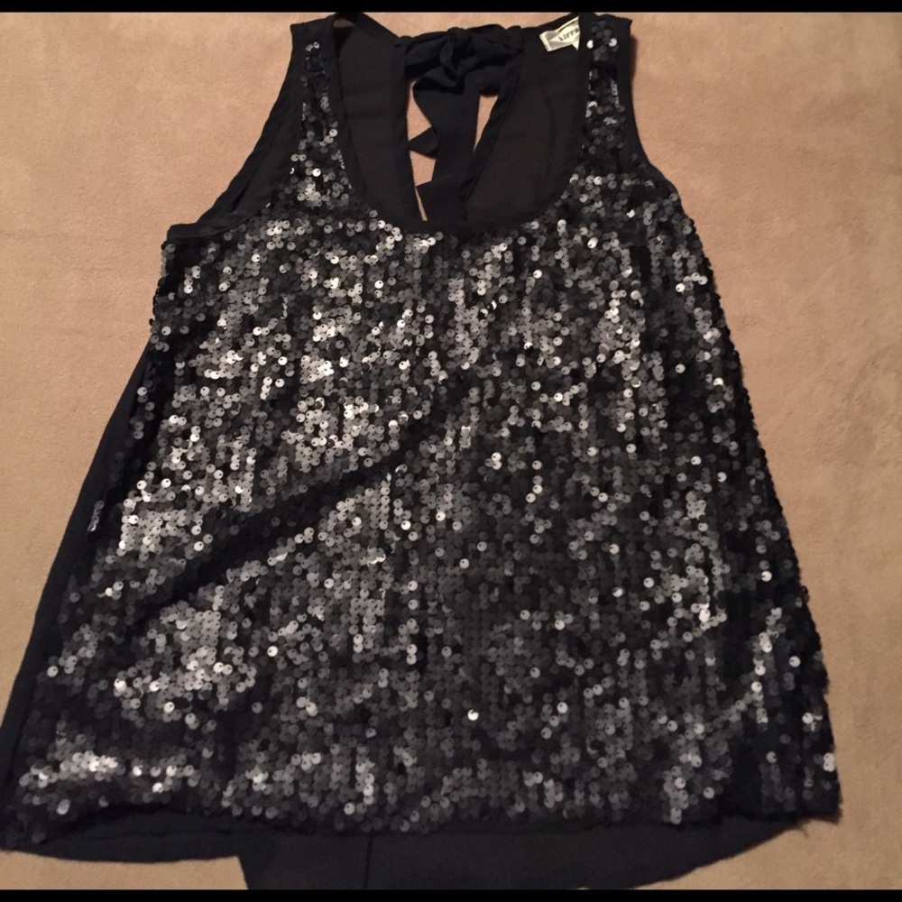Medium tank top. Sequined front. Mesh back w bow.