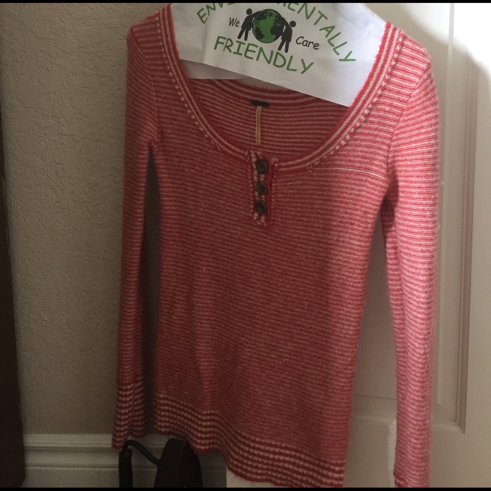 Orange and white striped sweater