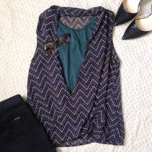 Flowy criss cross sleeveless blouse