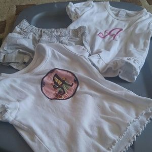 Two "A" monogrammed shorts and a pair of polka dot