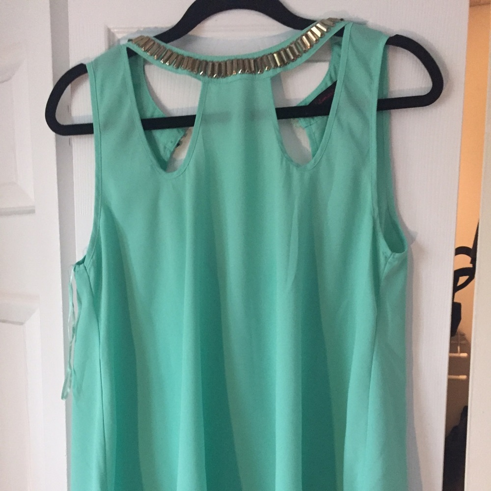 Green tank with gold embellishment
