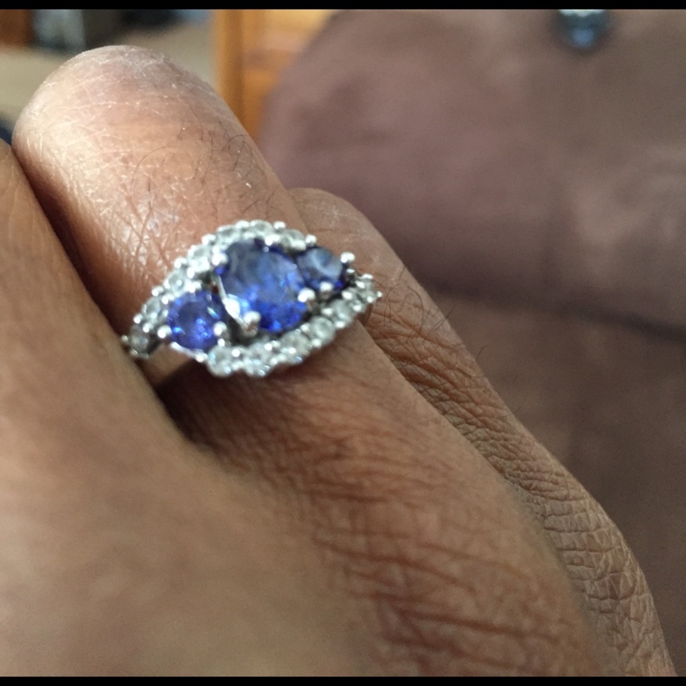 CZ 3 stone Tanzanite surrounded by clear CZs
