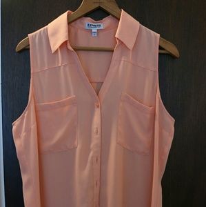 Orange sleeveless collared button down blouse
