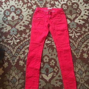 Red Free People jeans with zipper pockets