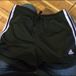 Black adidas with purple stripes