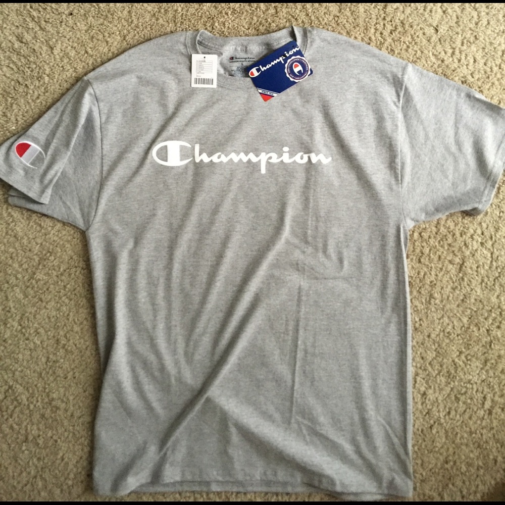 Brand new. Never worn. Champion Tee