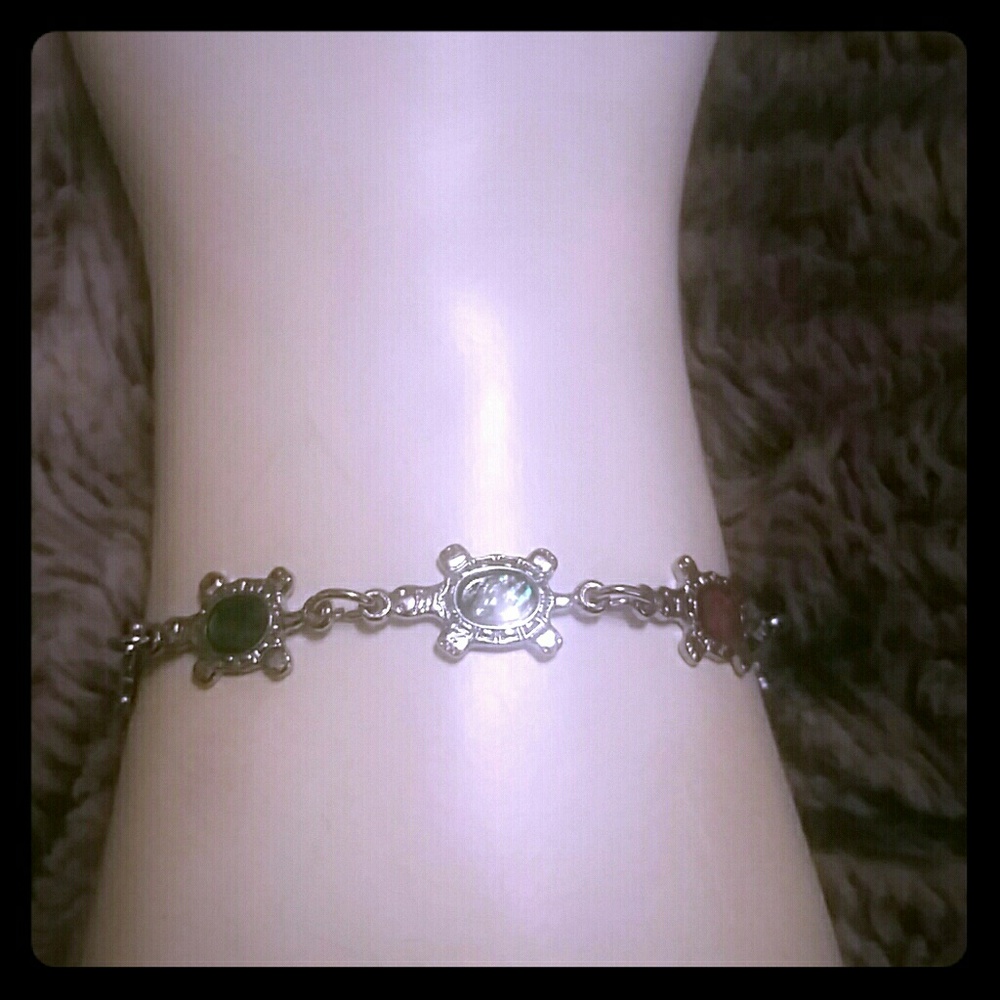 Paua shell inlaid turtle bracelet.