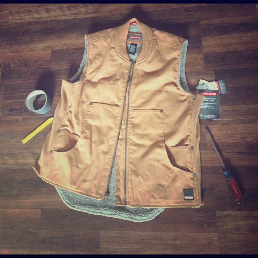 New with tags mens Craftsman Vest. Has a stain.