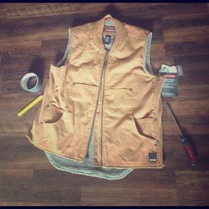 New with tags mens Craftsman Vest. Has a stain.