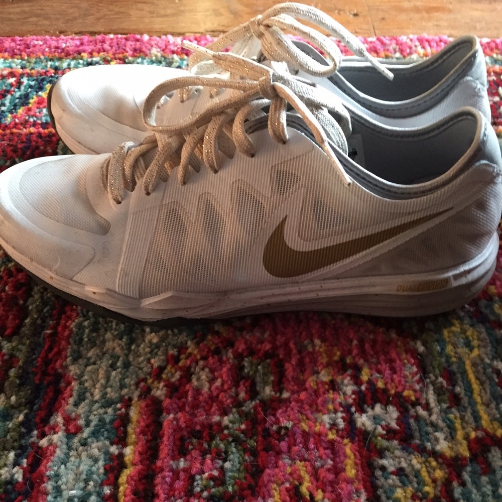 White Nikes with gold swish and gold laces size 7