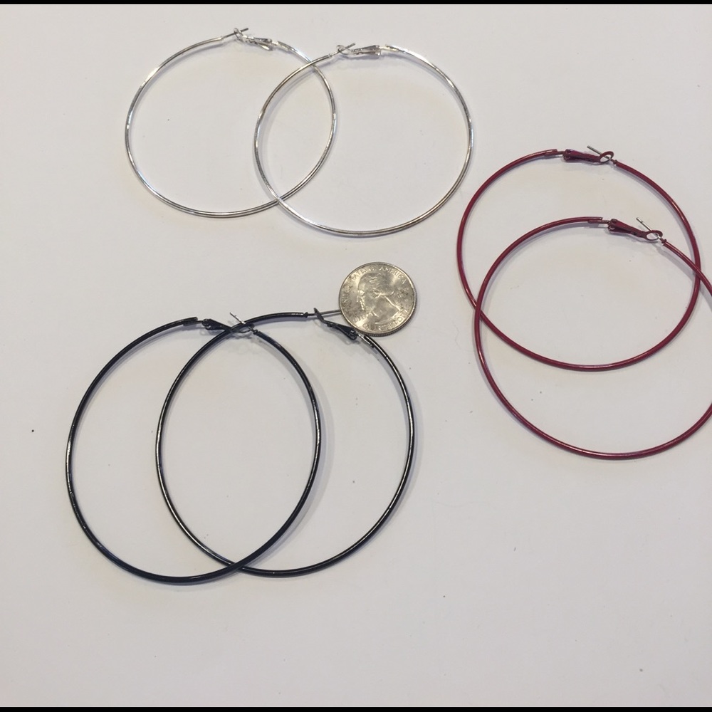Set of three large hoop earrings.