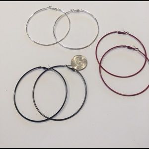 Set of three large hoop earrings.