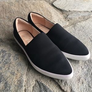 Jslides black and white slip on sneakers