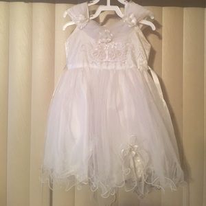 White toddler dress with beautiful trimming