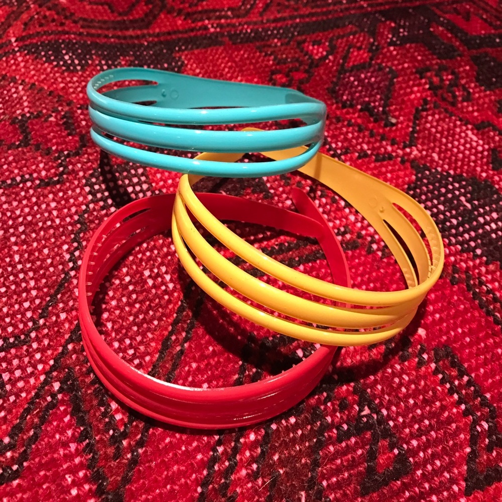 Three plastic headbands, in new condition
