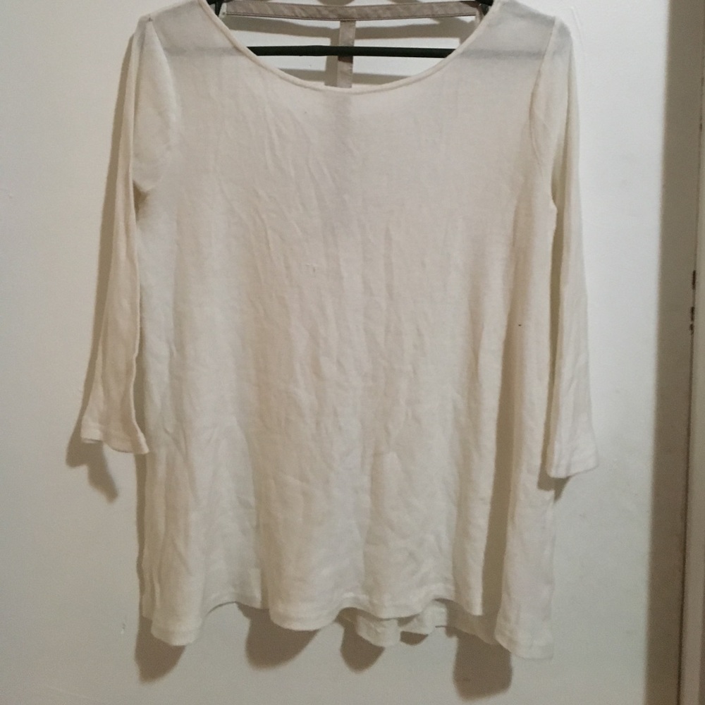 Soft White light shirt. Quarter sleeve open back.