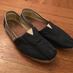 Toms navy and white shoes