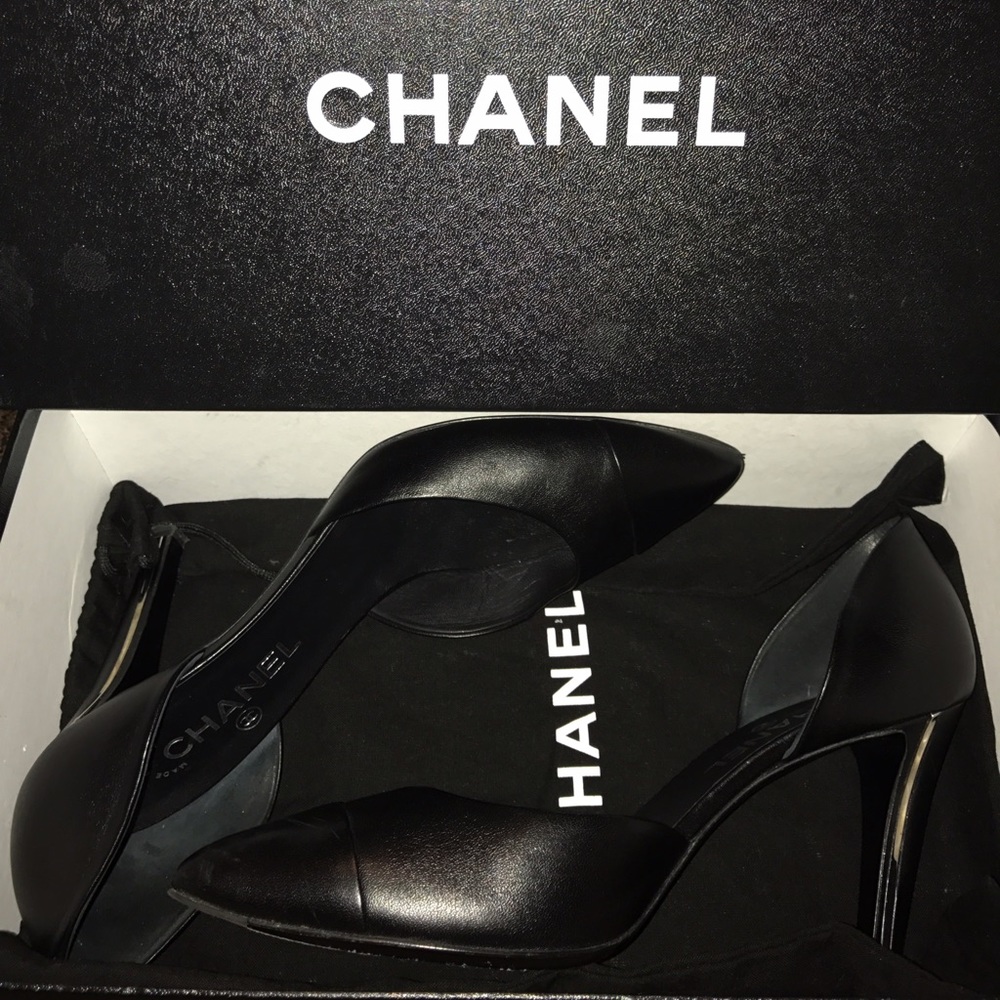 Black Chanel shoes.
