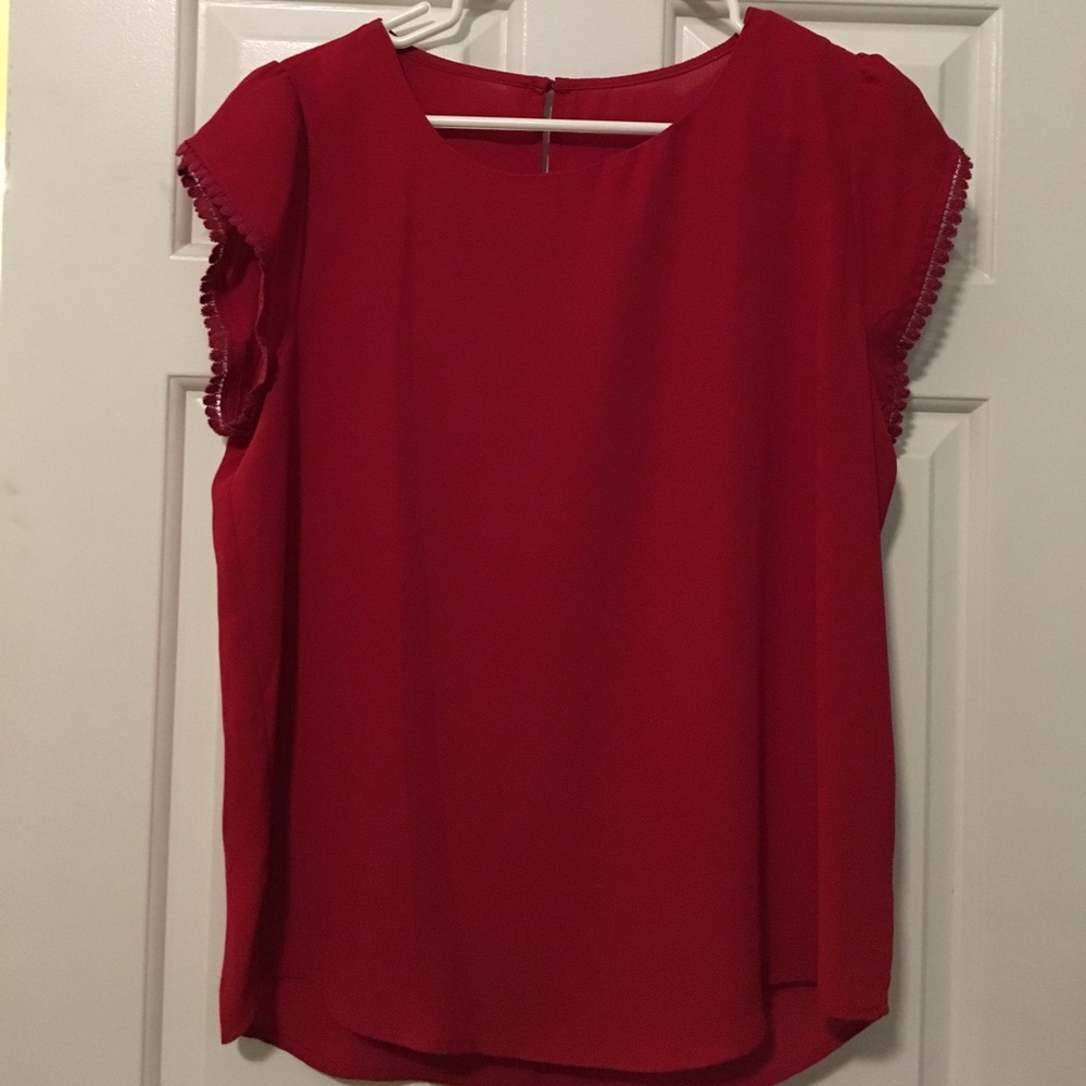 Dressy top with unique fringe sleeves