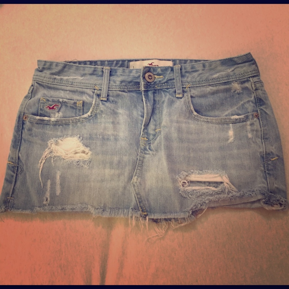 Distressed light denim mini skirt