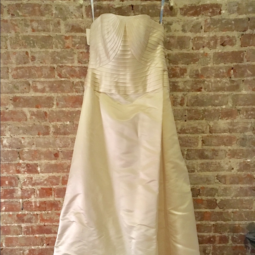 Never worn, 100% silk ivory wedding gown 
