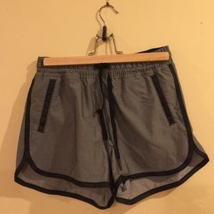 Dark grey lululemon shorts with black piping