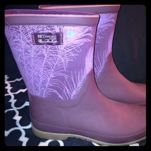 Purple rain boots with a feather detail.