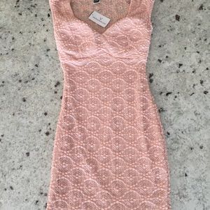 Light pastel pink dress.