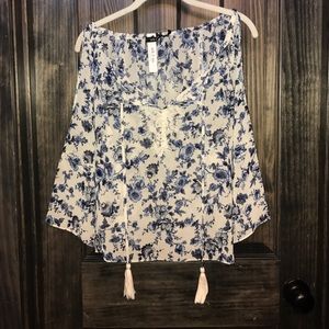 Blue and white floral "cold shoulder" tassel top