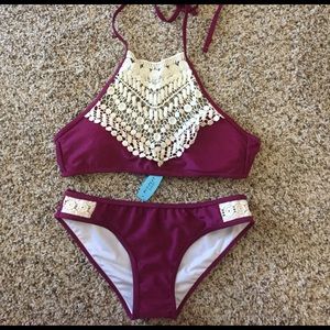 Maroon with white lace halter top bathing suit.