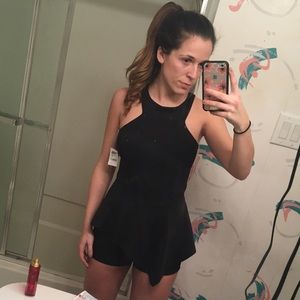 Black romper with overhang skirt look never worn