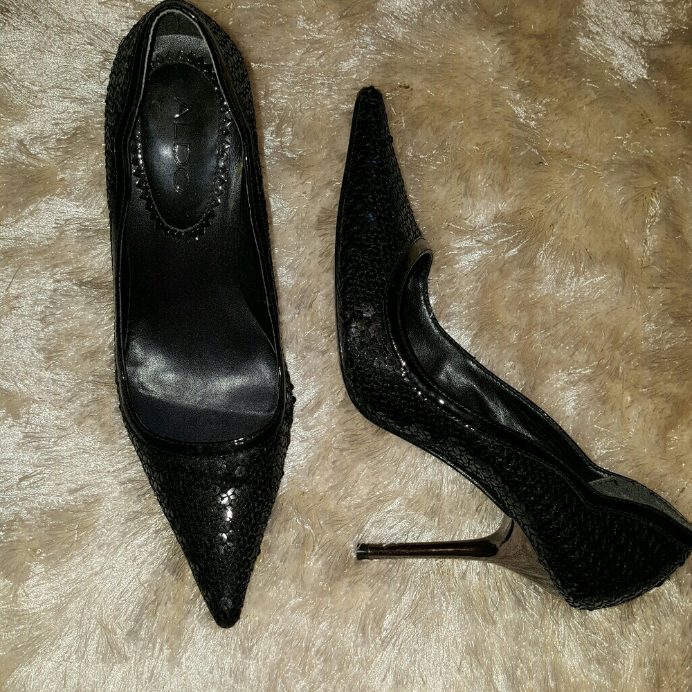 Black sequin pumps