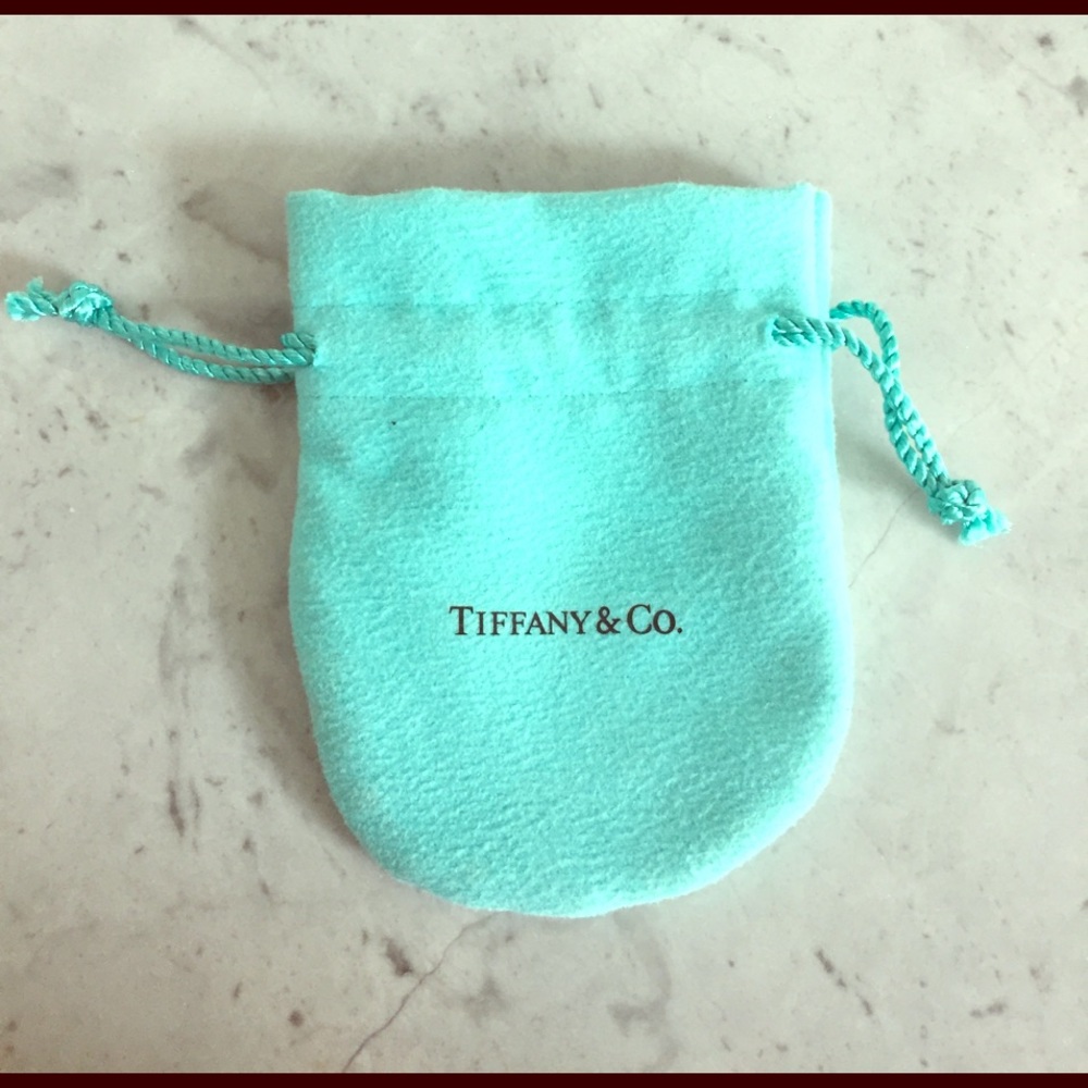 Authentic Tiffany & Co. dust bag.