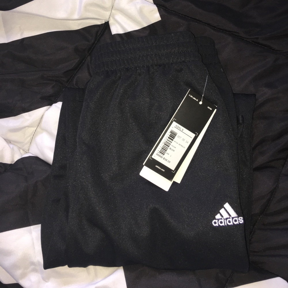 Black Adidas track pants