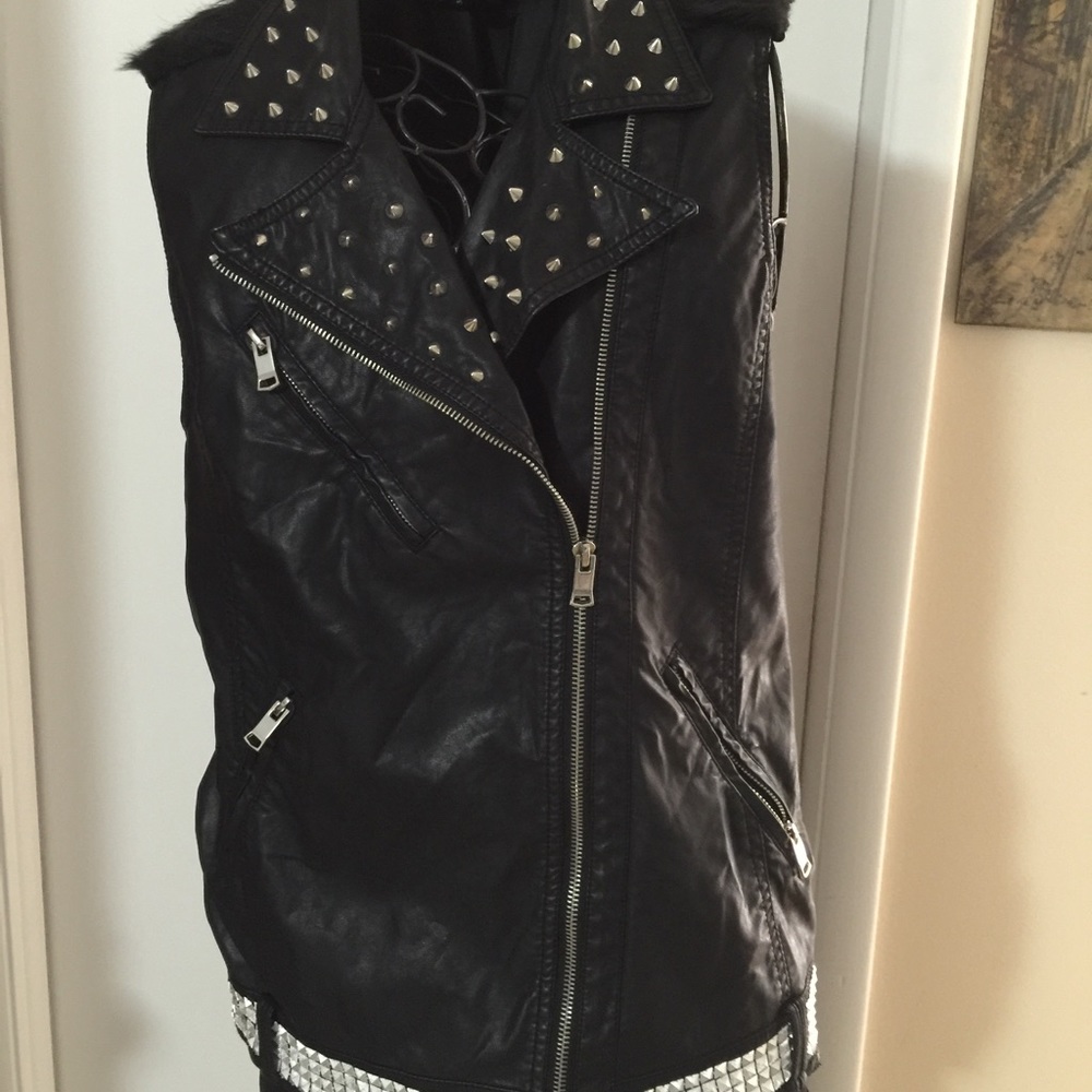 Faux leather vest with silver zippers and trim