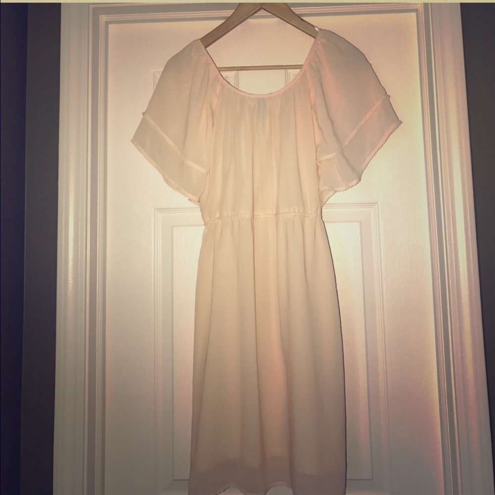 Feminine blush pink dress with ruffle sleeves