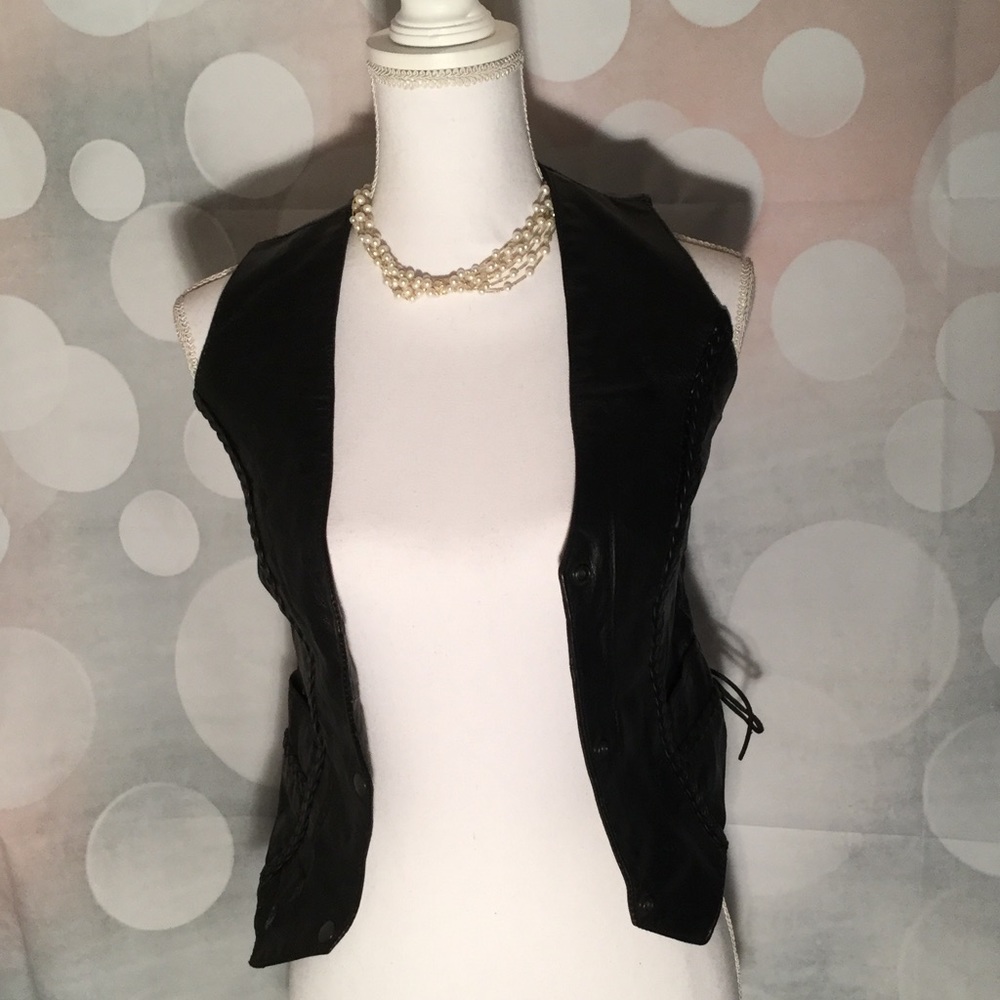 Black leather moto vest with detailed braiding